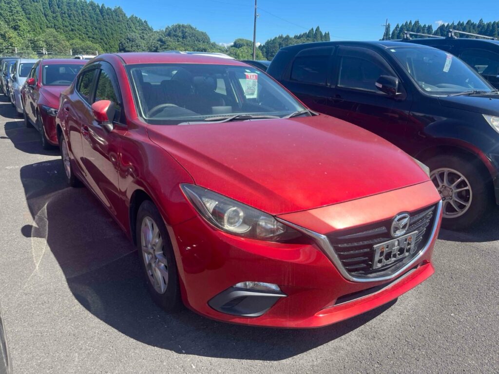 front side view of red 2014 Mazda Axela