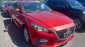 front side view of red 2014 Mazda Axela