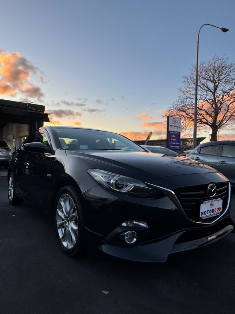front side view of black 2015 Mazda Axela