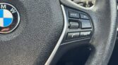 steering wheel closeup view of 2014 BMW 320i