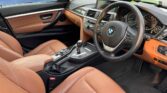 front door open view of 2014 BMW 320i