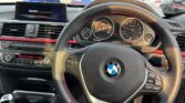 steering wheel view of 2014 BMW 320i
