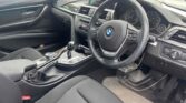 front door open view of 2014 BMW 320i I LUXURY