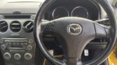 steering wheel view of 2003 Mazda Atenza