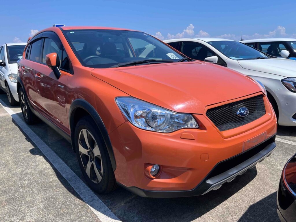 front side view of orange 2014 Subaru XV