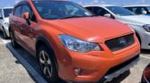 front side view of orange 2014 Subaru XV
