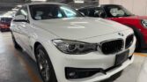 front side view of white used car 2014 BMW 320i