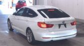 back side view of white 2014 BMW 320i