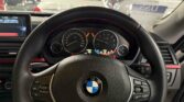 steering wheel view of 2014 BMW 320i