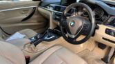 front door open view of 2014 BMW 320i