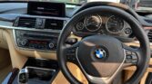 steering wheel view of used 2014 BMW 320i