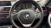 steering wheel view of 2014 BMW 320i