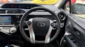 steering wheel view of 2016 Toyota Aqua