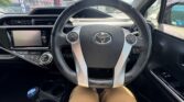 steering wheel view of 2016 Toyota Aqua