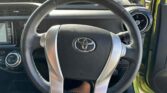 steering wheel view of 2015 Toyota Aqua