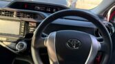 steering wheel view of 2015 Toyota Aqua