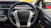 steering wheel view of 2015 Toyota Aqua