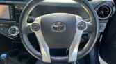 steering wheel view of 2015 Toyota Aqua